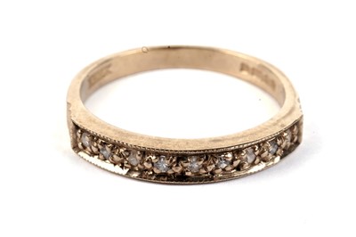 Lot 638 - A diamond half hoop eternity ring