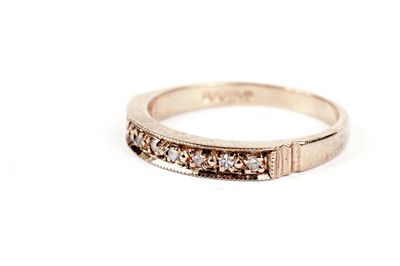 Lot 546 - A diamond half hoop eternity ring