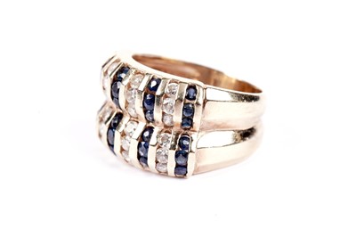 Lot 548 - A sapphire and diamond dress ring
