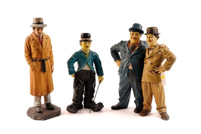 Lot 225 - A selection of comedic figures including Laurel and Hardy