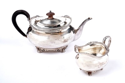 Lot 1334 - A George V teapot and matching milk jug