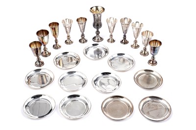 Lot 1335 - Eleven Kiddish cups; and eleven coasters