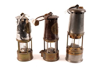 Lot 431 - Two Eccles miners safety lamps; and another