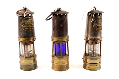 Lot 433 - Three miners safety lamps