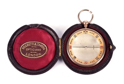 Lot 464 - Negretti & Zambra, London (retailer): a 9ct yellow gold mounted compass