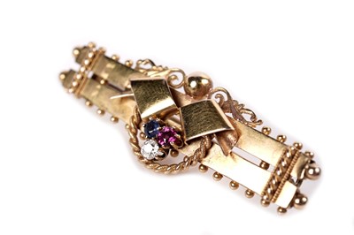 Lot 1144 - A Victorian ruby, sapphire, and diamond bar brooch