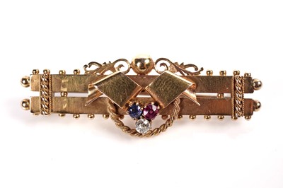 Lot 1144 - A Victorian ruby, sapphire, and diamond bar brooch