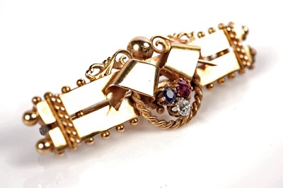 Lot 1144 - A Victorian ruby, sapphire, and diamond bar brooch