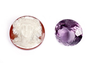 Lot 676 - A carved hardstone cameo; and an amethyst