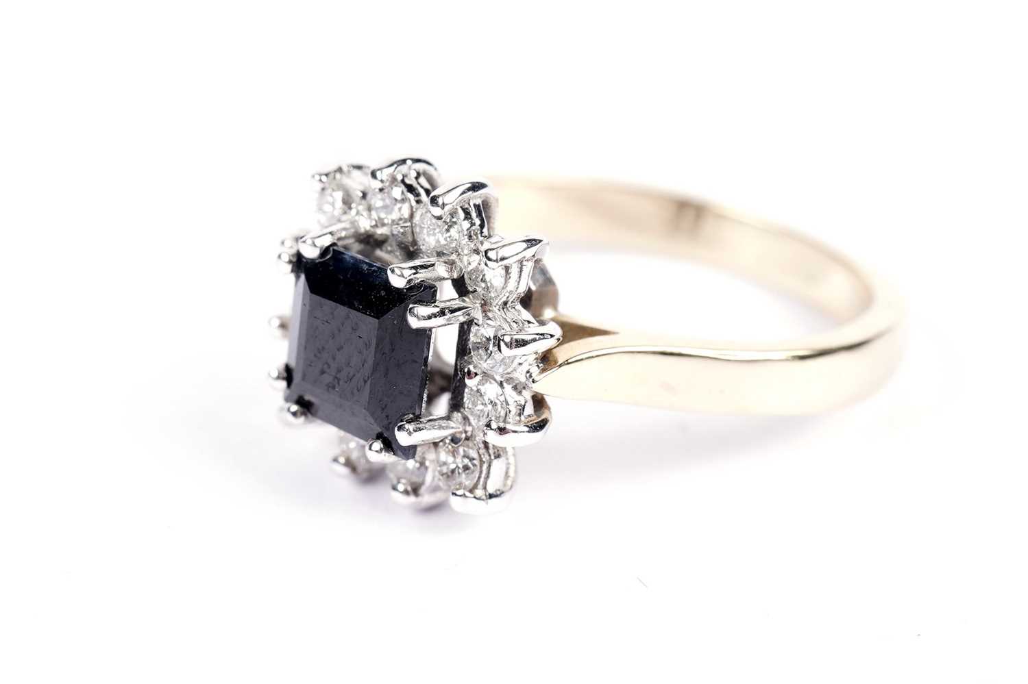 Lot 603 - A contemporary sapphire and diamond cluster ring