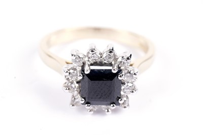 Lot 603 - A contemporary sapphire and diamond cluster ring