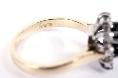 Lot 603 - A contemporary sapphire and diamond cluster ring