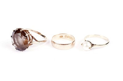Lot 598 - Three rings including a smoky quartz dress ring