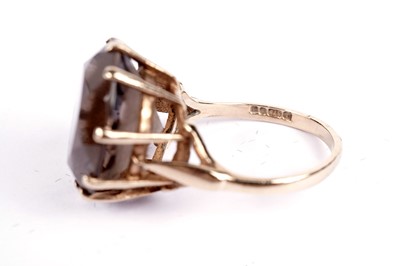 Lot 598 - Three rings including a smoky quartz dress ring