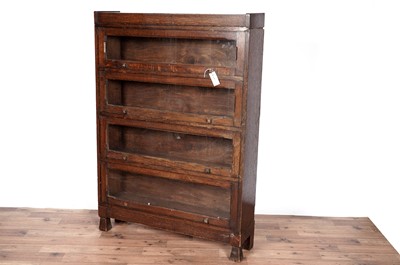Lot 26 - An early 20th Century oak barristers bookcase