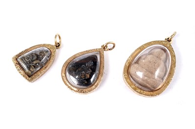 Lot 1720 - Three small 20th Century gold-mounted pendant jewels