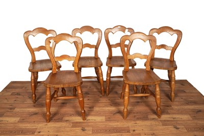 Lot 4 - A set of six Victorian-style pine balloon back dining chairs