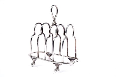 Lot 774 - A George V silver five bar toast rack