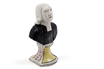 Lot 478 - An early 19th Century Staffordshire pearlware miniature bust of Rev John Wesley