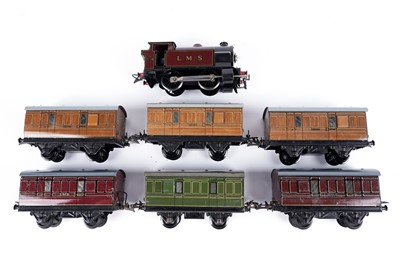 Lot 333 - A Hornby 0-gauge 0-4-0 locomotive; and six various coaches