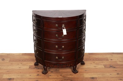 Lot 3 - A mid-20th Century carved mahogany and ebonized wood demi lune chest of drawers