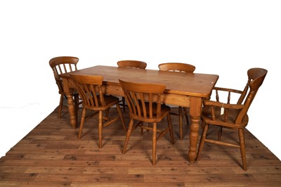 Lot 5 - A Victorian style pine farmhouse dining table; a set of six Victorian style dining chairs