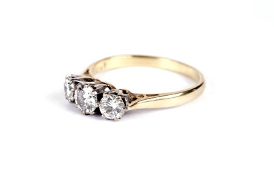 Lot 518 - A diamond three stone ring