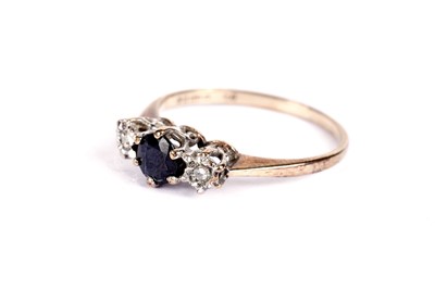 Lot 523 - A sapphire and diamond three stone ring