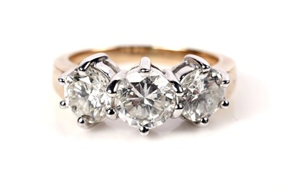 Lot 1204 - A three stone diamond ring