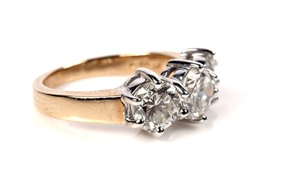 Lot 1204 - A three stone diamond ring