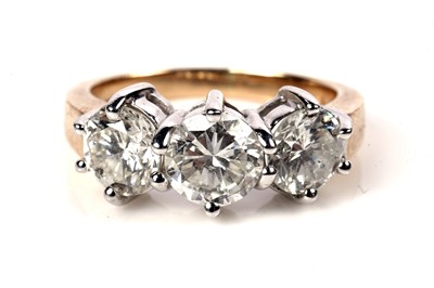 Lot 1204 - A three stone diamond ring