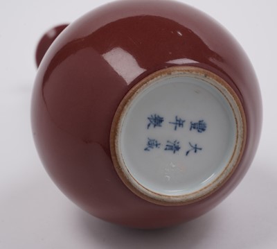 Lot 357 - A Chinese liver-red bottle vase