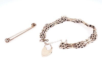 Lot 574 - A rose gold bracelet; and a bar brooch