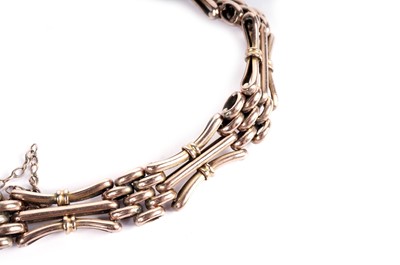 Lot 574 - A rose gold bracelet; and a bar brooch