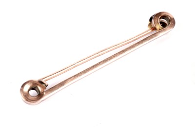 Lot 574 - A rose gold bracelet; and a bar brooch
