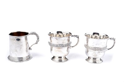 Lot 1352 - A pair of Elizabeth II and one other silver mugs