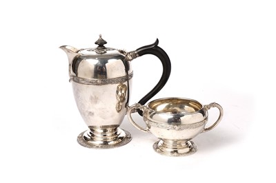 Lot 1353 - A George V silver hot water jug and matching sugar bowl