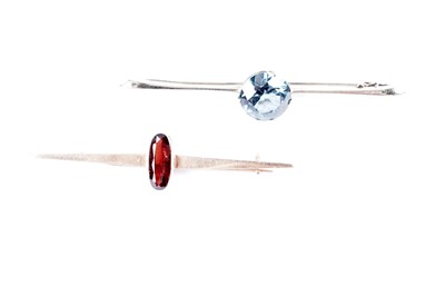 Lot 636 - A synthetic blue spinel bar brooch; and a garnet brooch