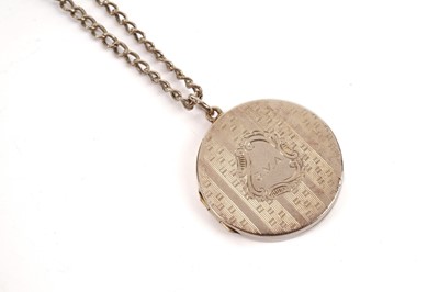 Lot 661 - An 18ct gold locket on chain