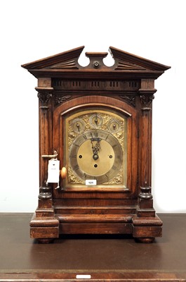 Lot 121 - A late 19th Century carved oak bracket clock