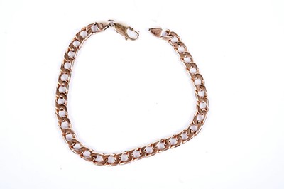 Lot 665 - A rose gold curb link chain bracelet