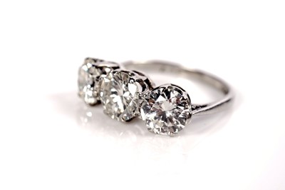 Lot 1208 - A three stone diamond ring