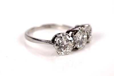 Lot 1208 - A three stone diamond ring