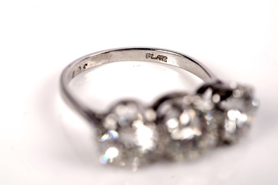 Lot 1208 - A three stone diamond ring