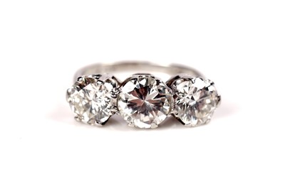 Lot 1208 - A three stone diamond ring