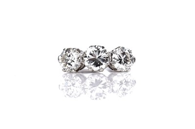 Lot 1208 - A three stone diamond ring