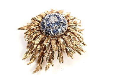 Lot 1215 - A sapphire, diamond, and 18ct gold sunburst or flowerhead brooch