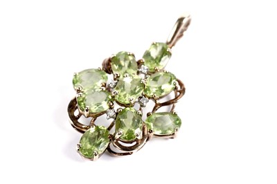 Lot 420 - A peridot and diamond pendant