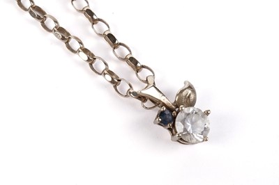 Lot 633 - A white stone and sapphire pendant on chain