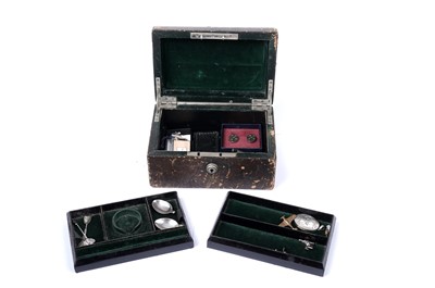 Lot 1684 - A Victorian green leather jewellery box containing various silver items